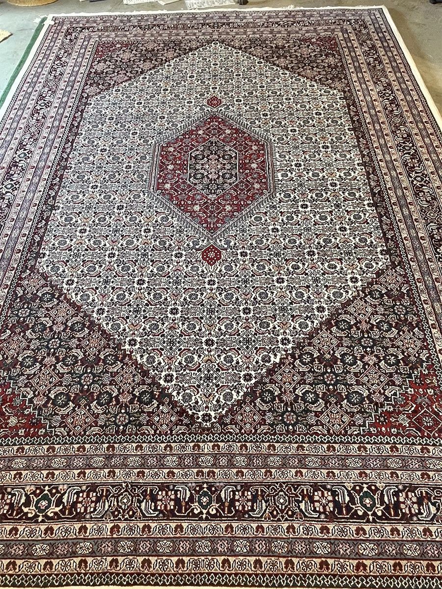 A rug with a detailed pattern on it.