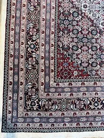A rug with a detailed pattern on it.