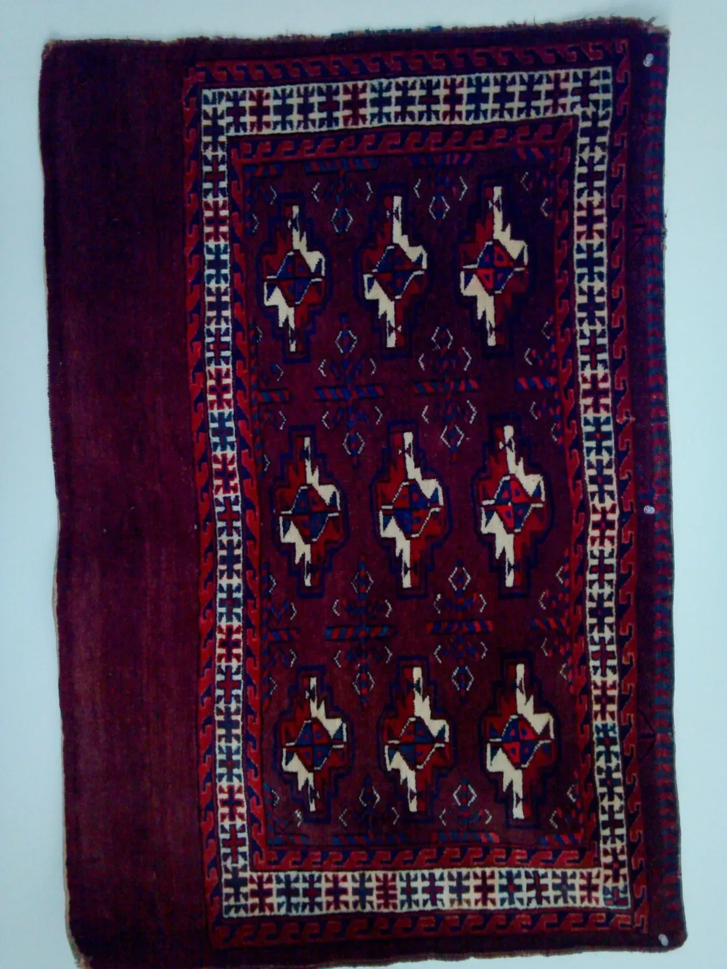 A rug with a detailed pattern on it.