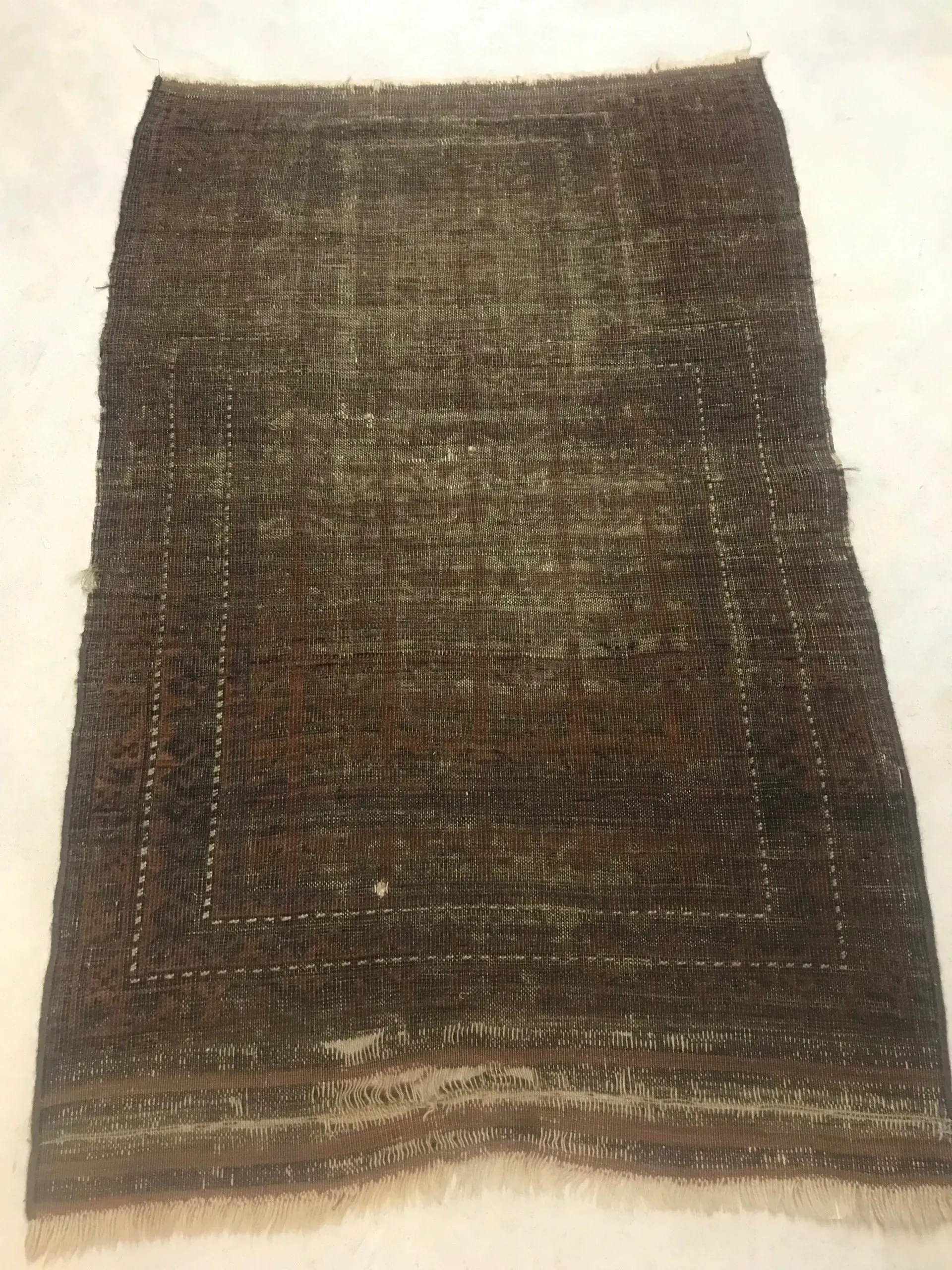 A rug with a detailed pattern on it.