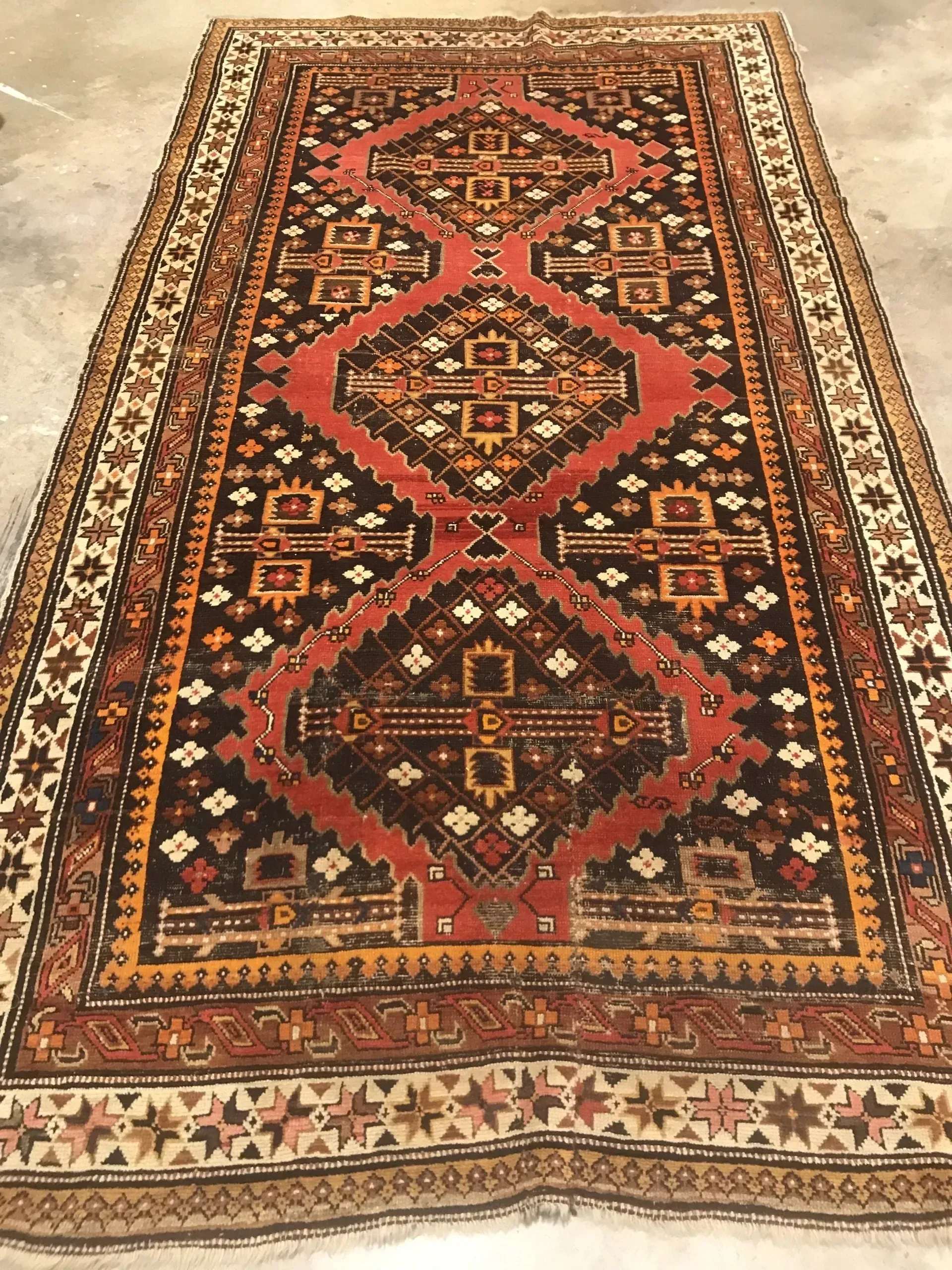 A rug with a detailed pattern on it.