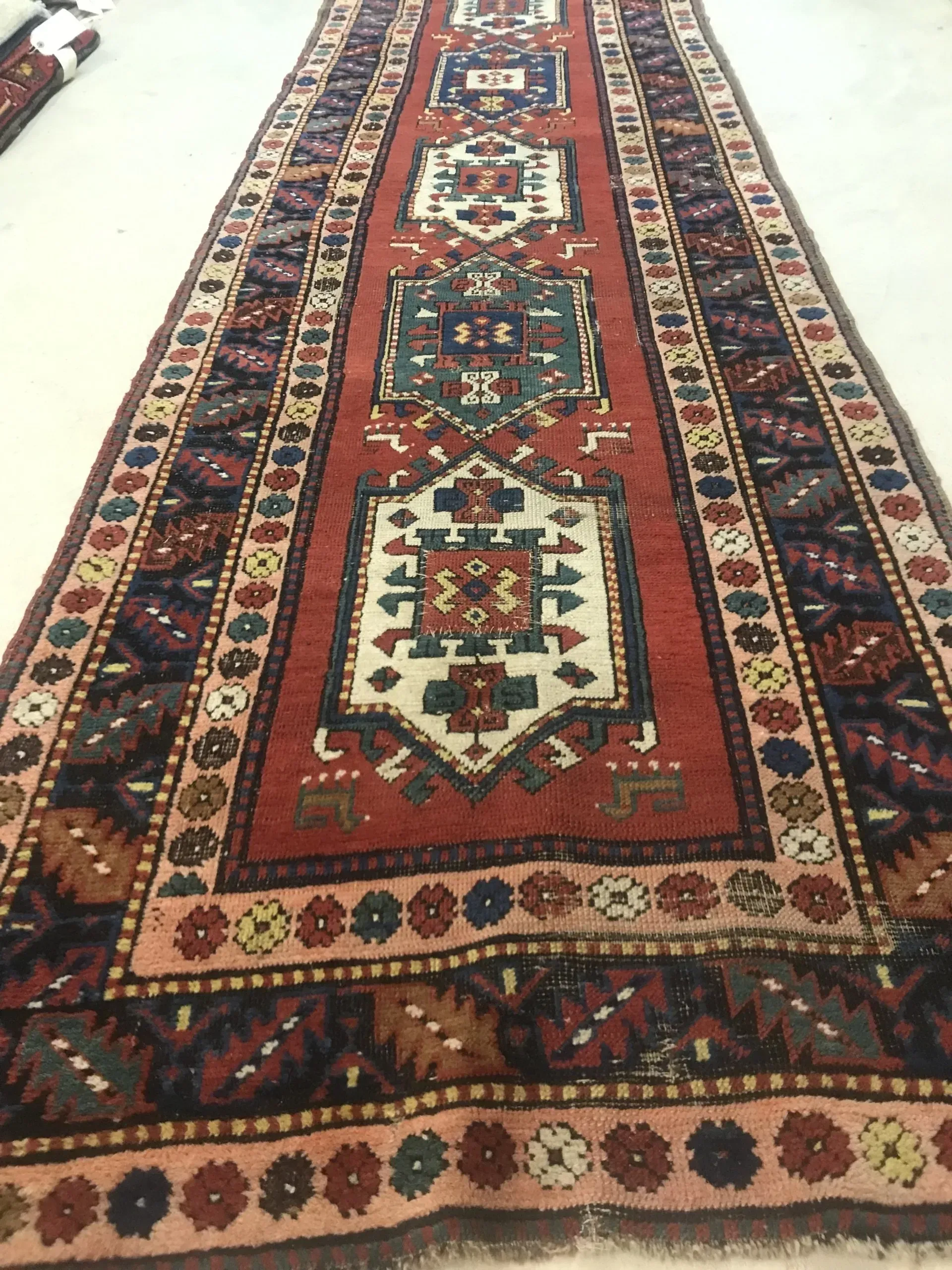 A rug with a detailed pattern on it.