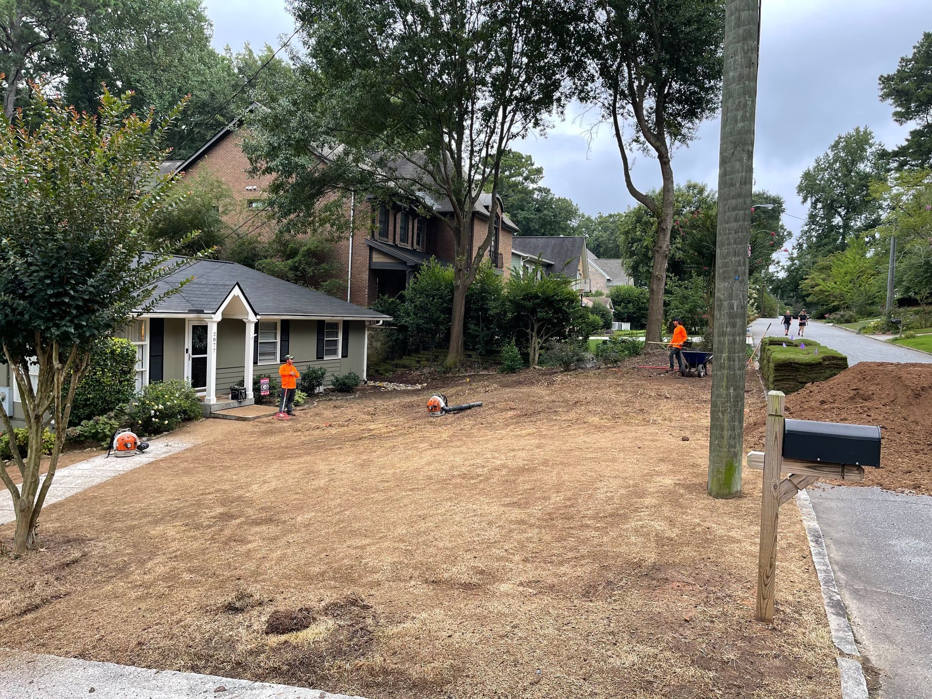 A house with a lot of dirt in front of it.