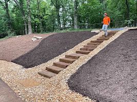 A man is walking up a set of stairs.