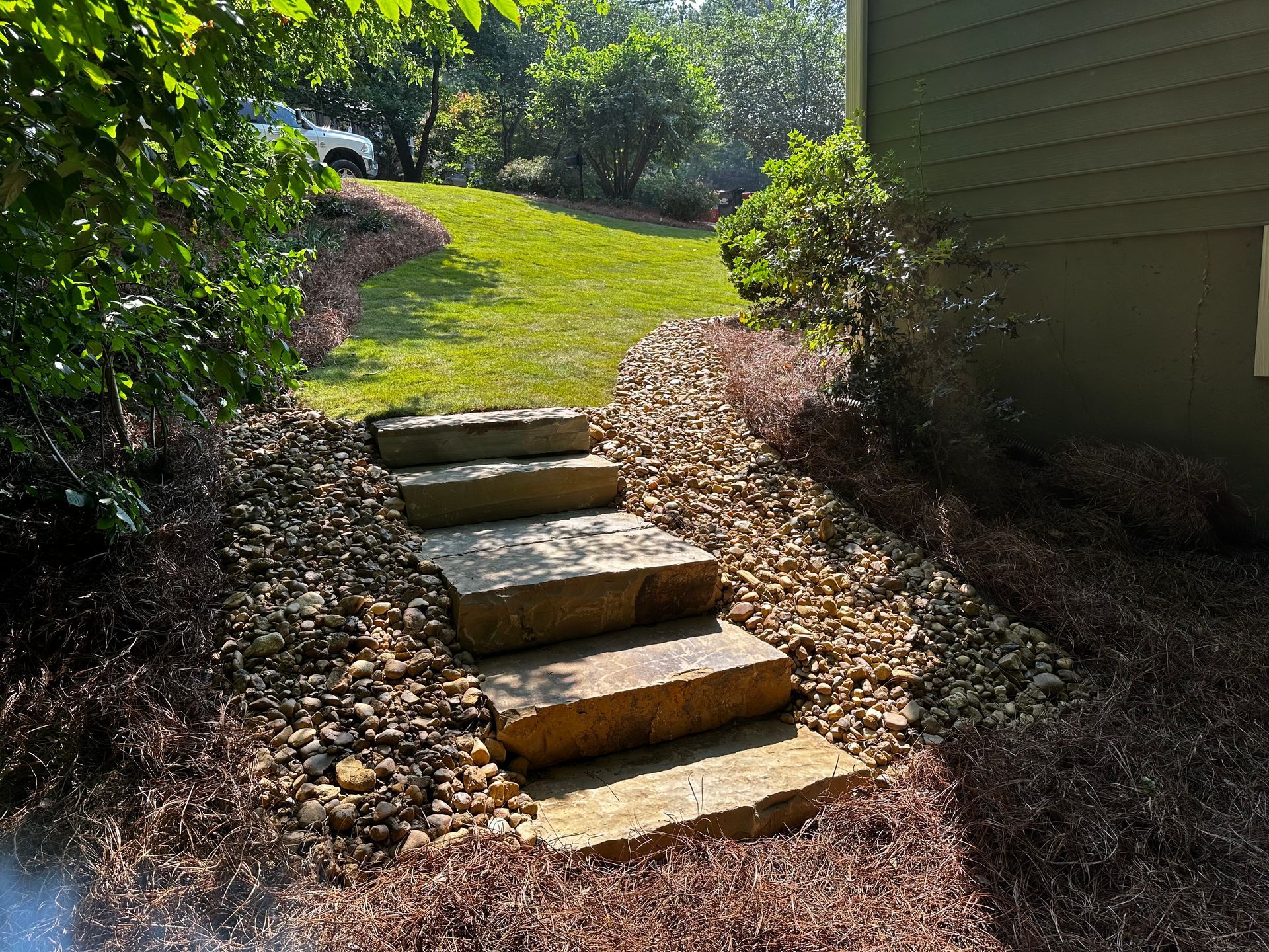 A set of stone steps leading up to a house.