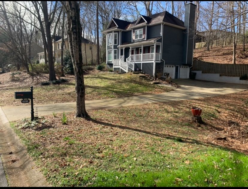 A large house with a mailbox in front of it.