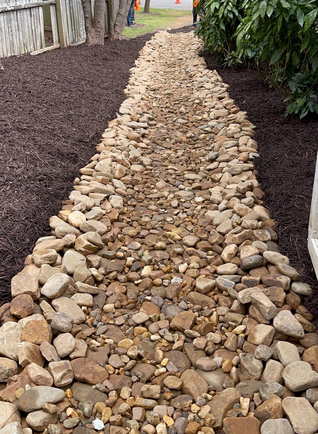 A path made of rocks leading to a house.