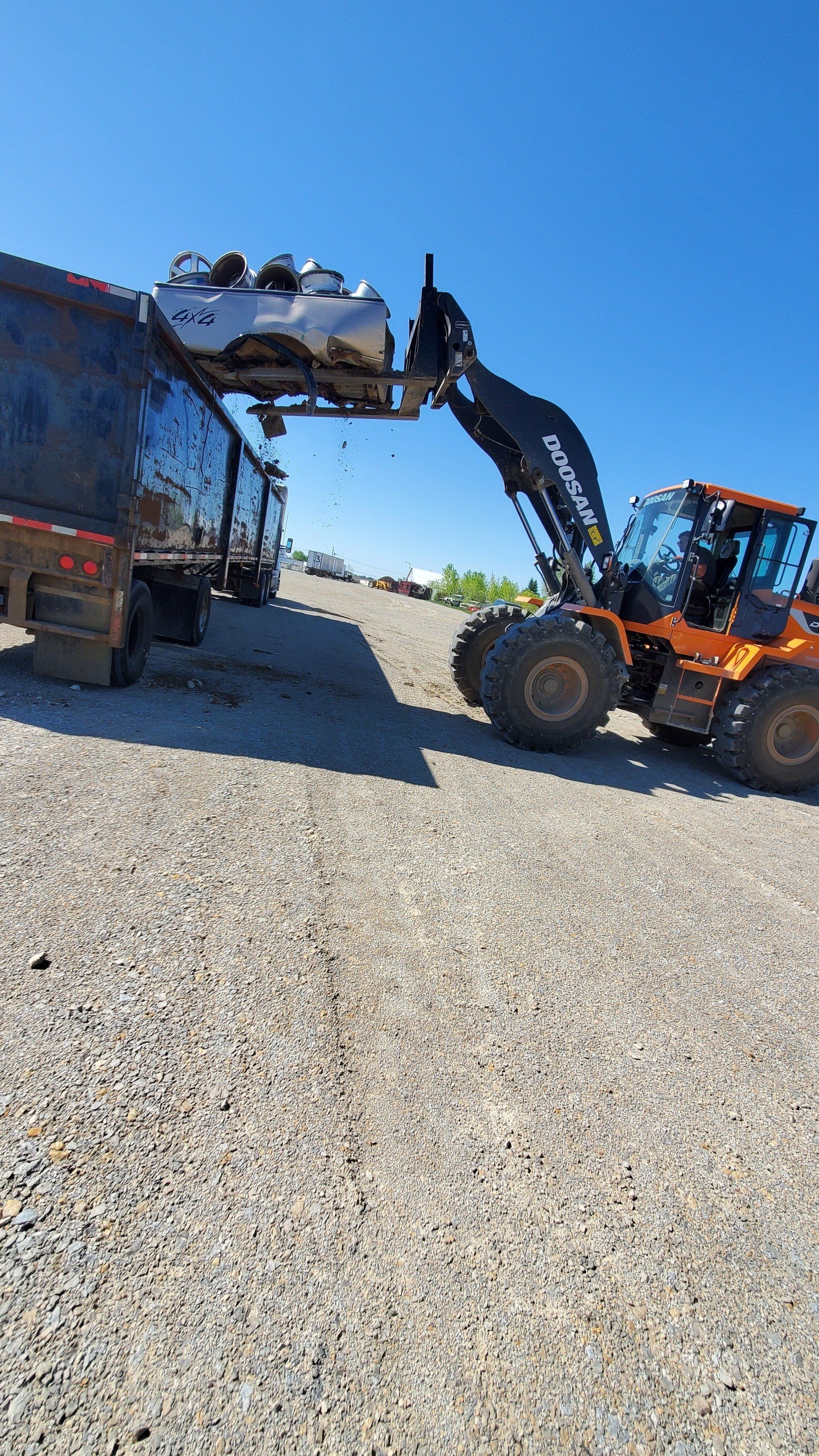 Truck loading the dumpster