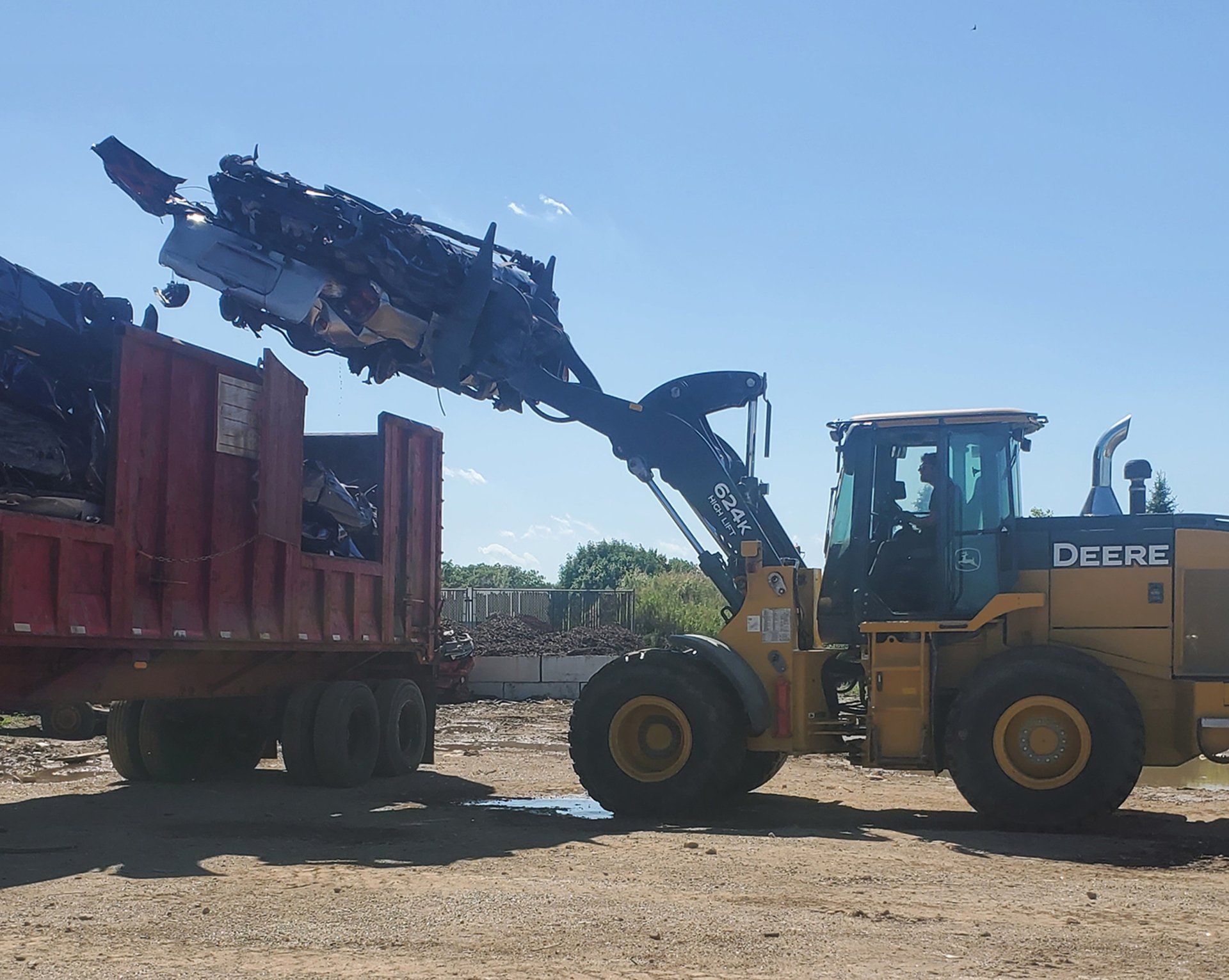 Dumpster and tractor