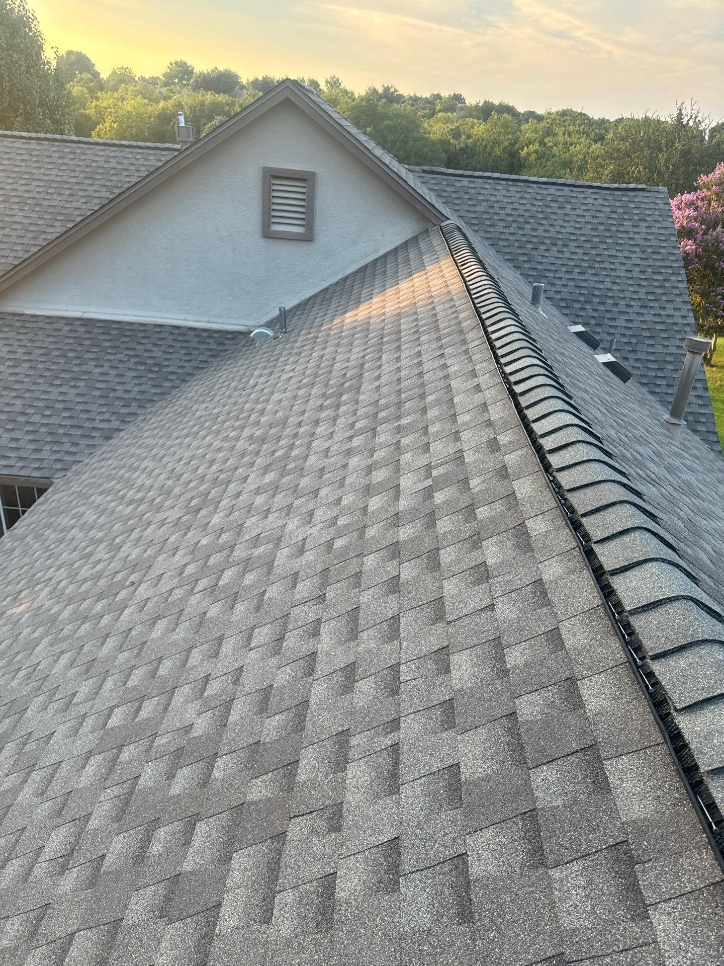 A close up of a roof with shingles on it.
