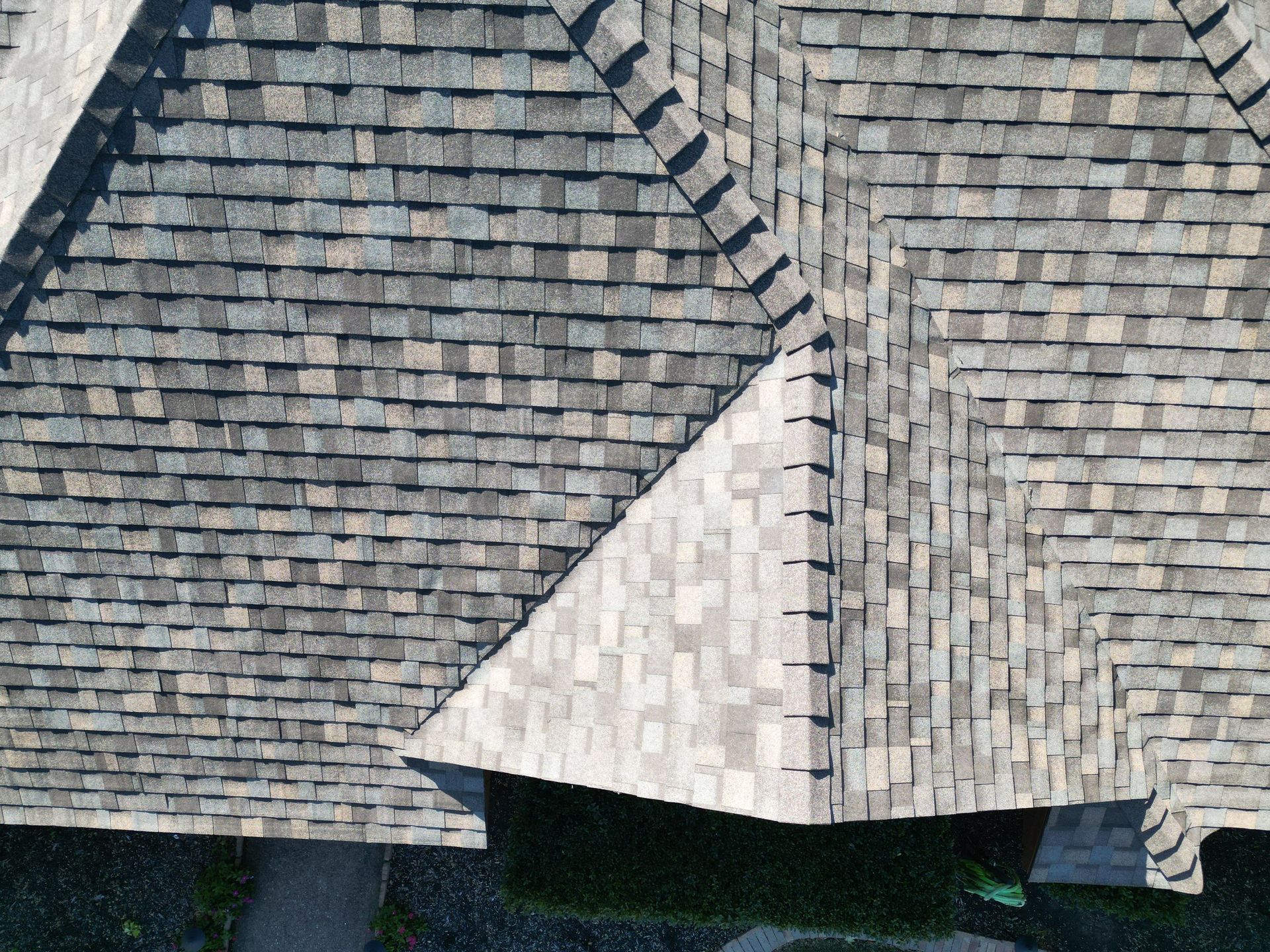 An aerial view of a roof with shingles on it