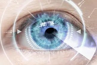 A human eye with a glowing, circular blue digital interface overlay, suggesting biometric scanning or technology.