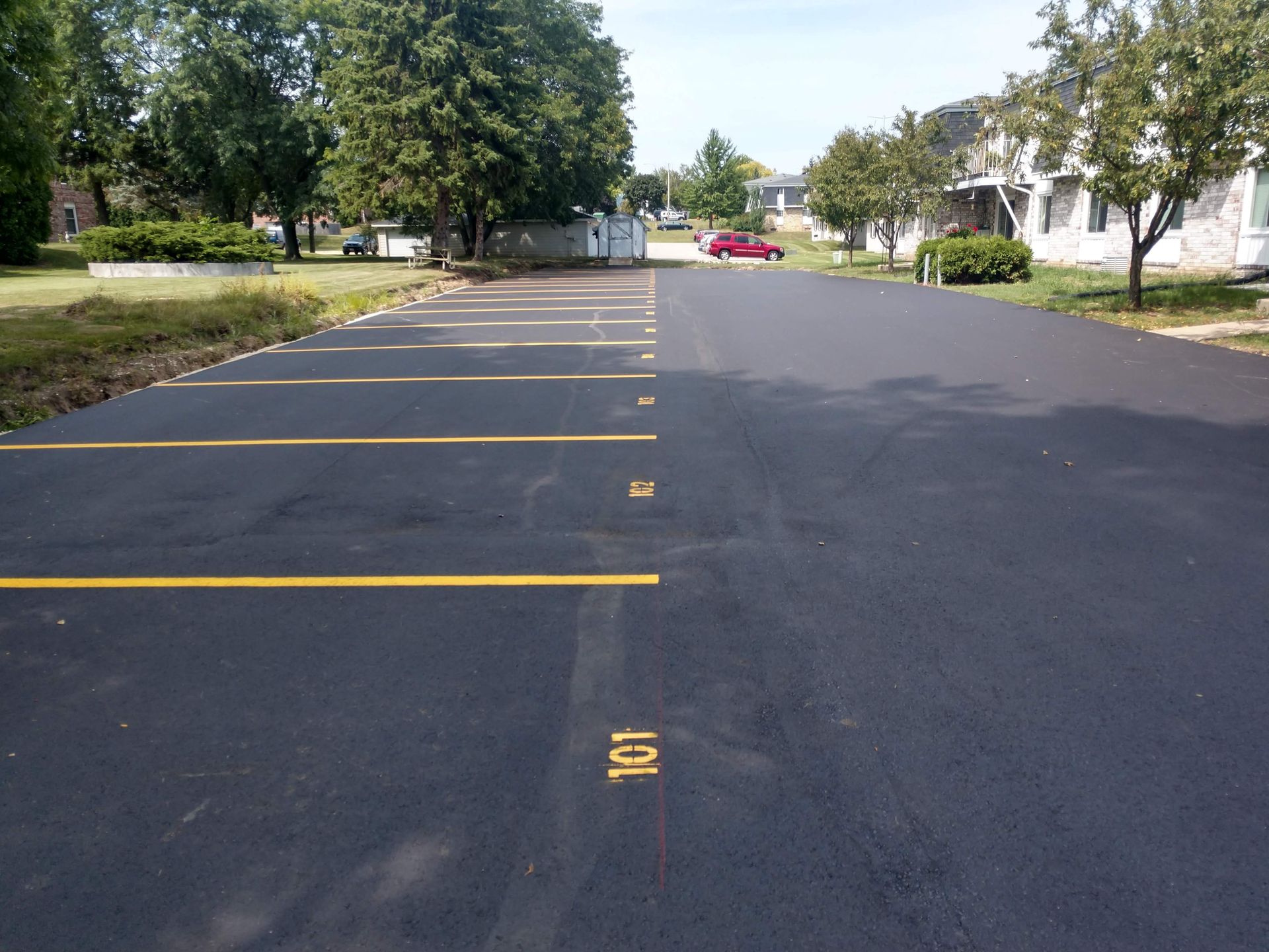 A parking lot with the number 101 painted on it.