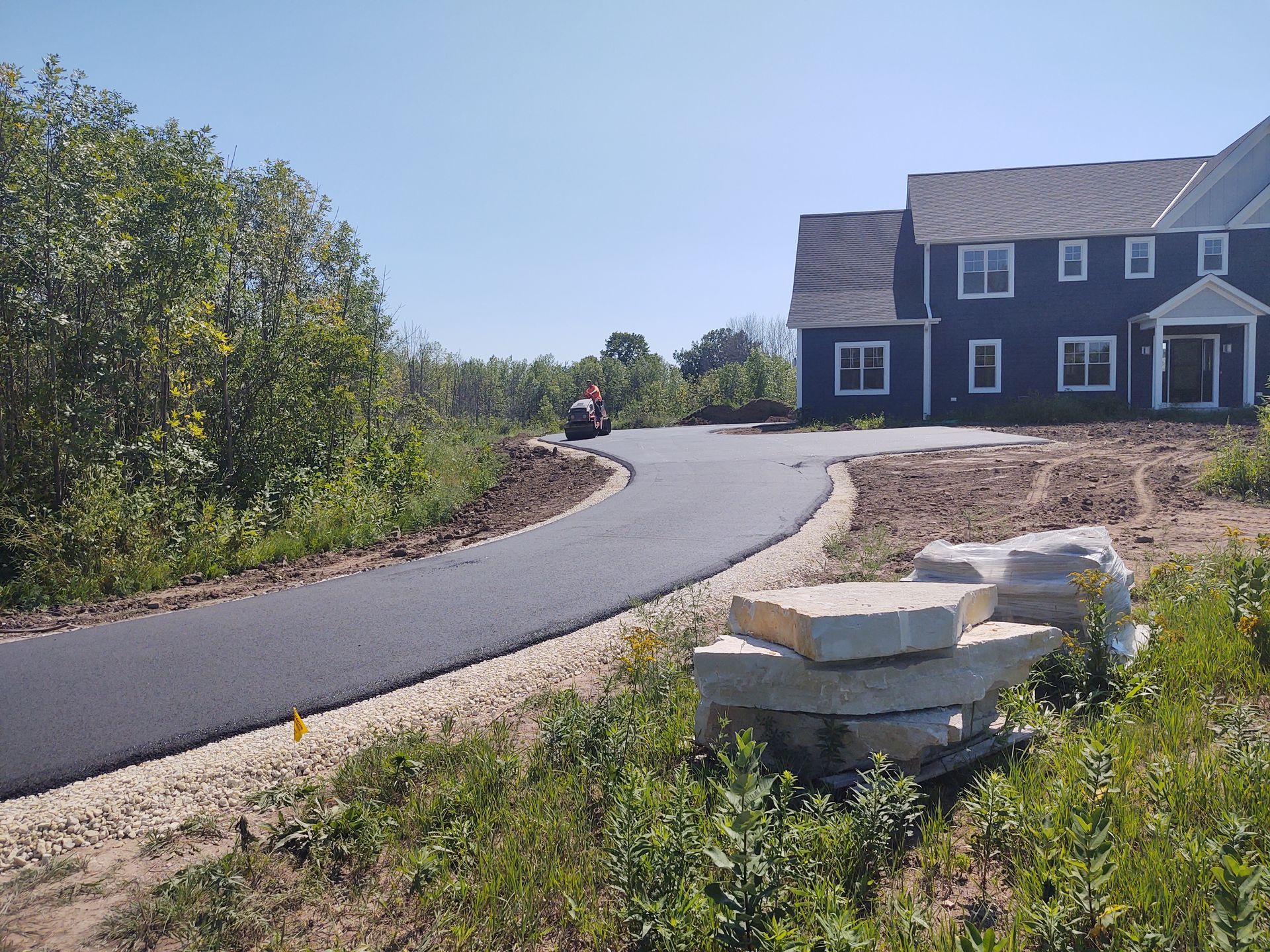 A house is being built on the side of a road.