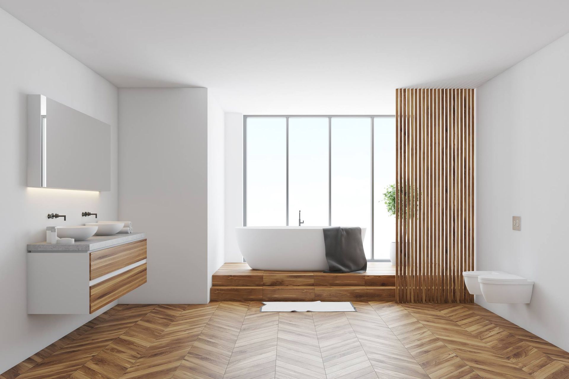 Modern bathroom with a bathtub, wooden accent wall, and wood flooring.