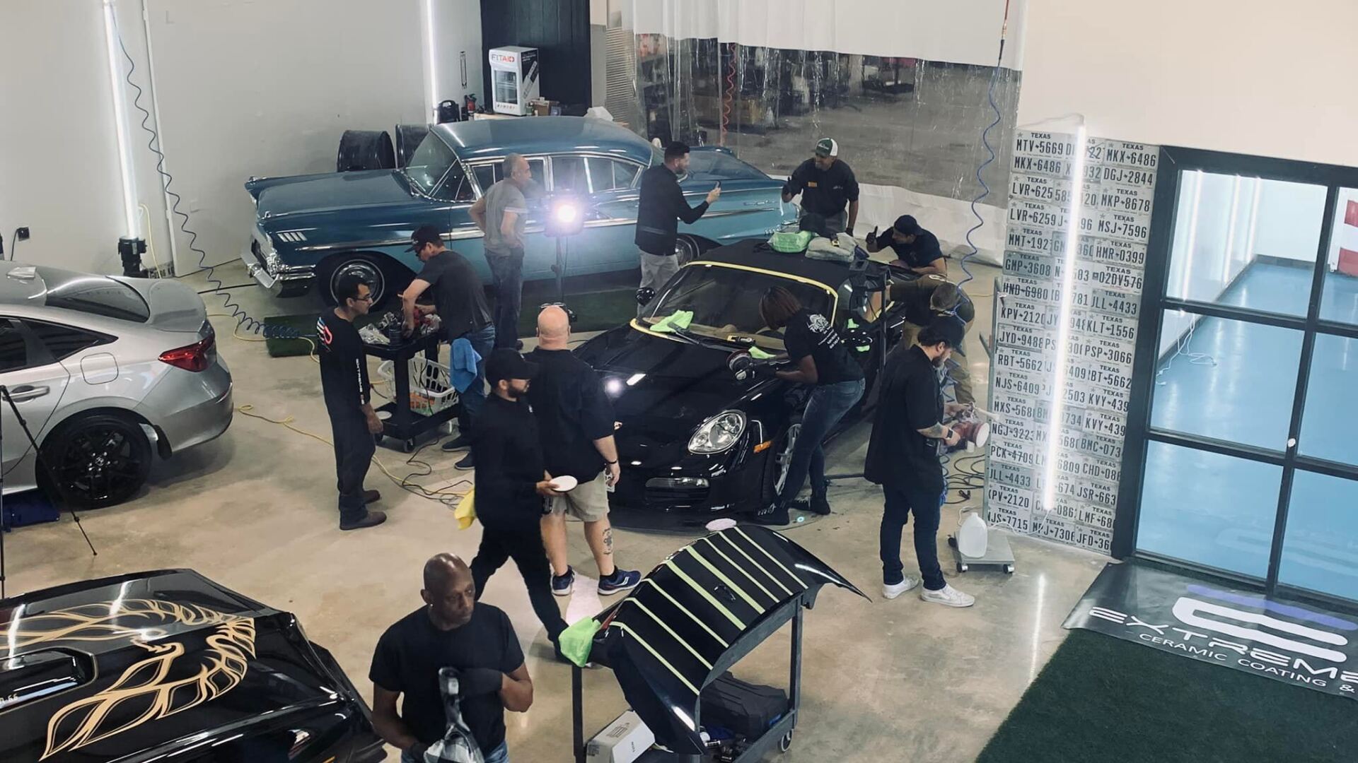 Staff detailing a car