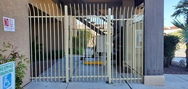 there is a handicapped sign on the side of the fence