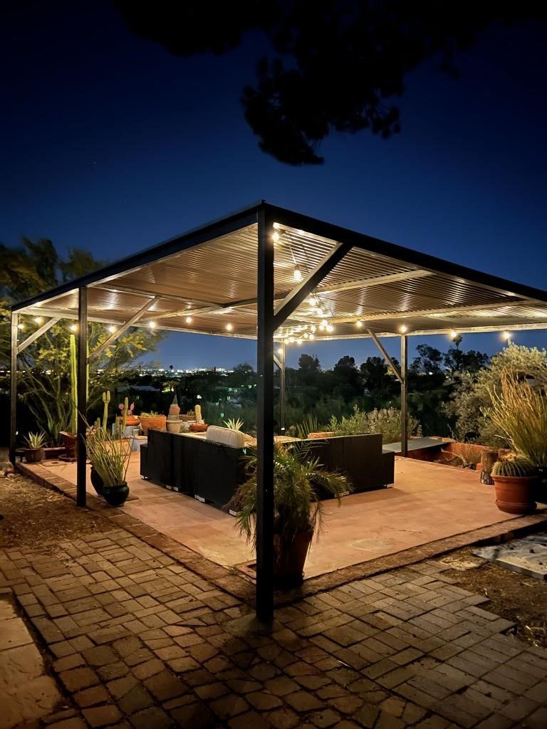 a gazebo with a lot of lights on it at night