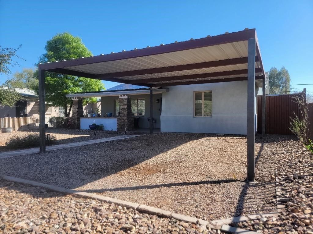 a house with a carport in front of it