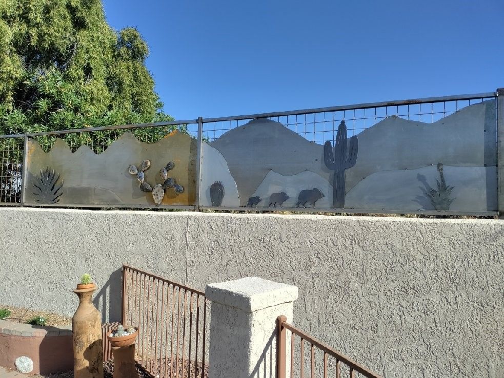 a fence with a picture of a cactus on it