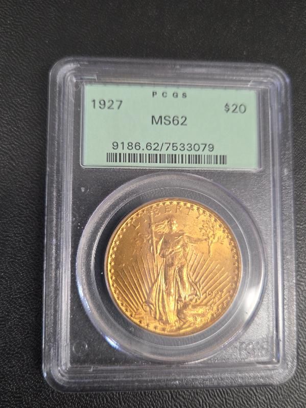 Graded 1927 gold coin in a plastic slab, labeled MS62, with a certification sticker above.
