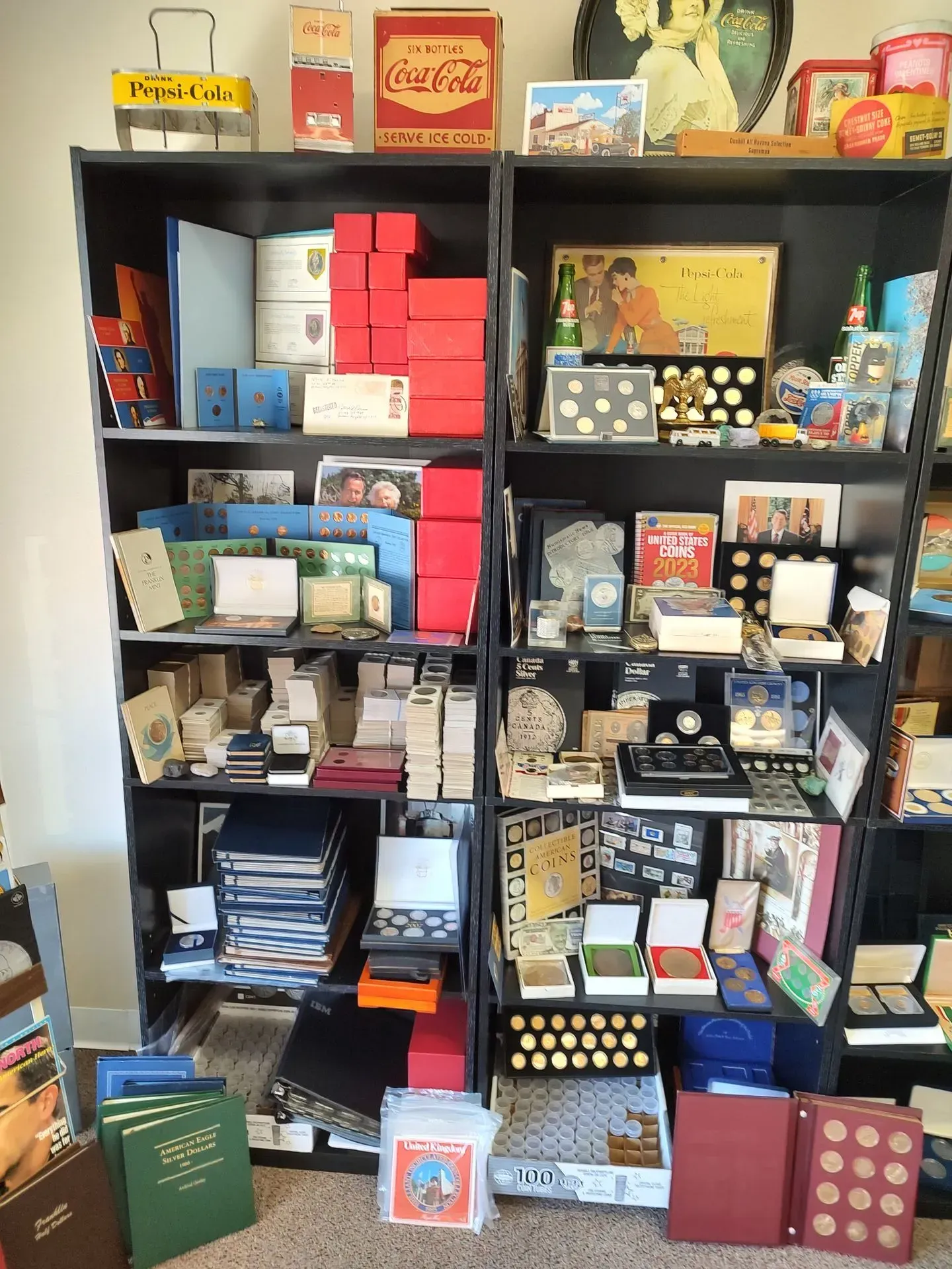 Shelves filled with coin collections, boxes, and related memorabilia.