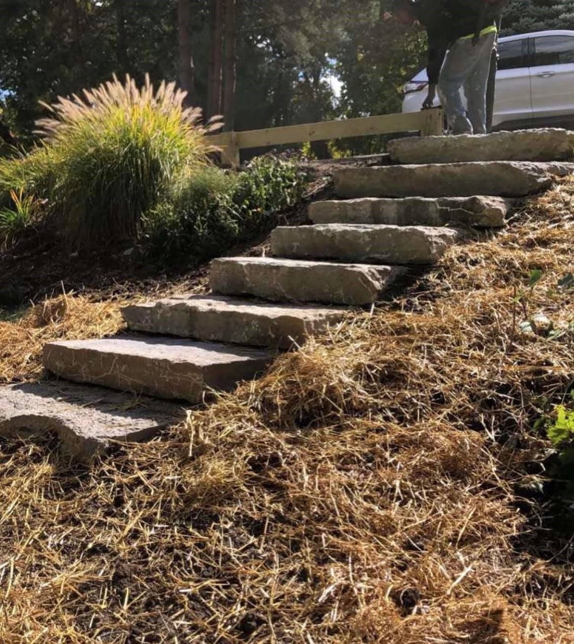 A set of stone steps going up a hill
