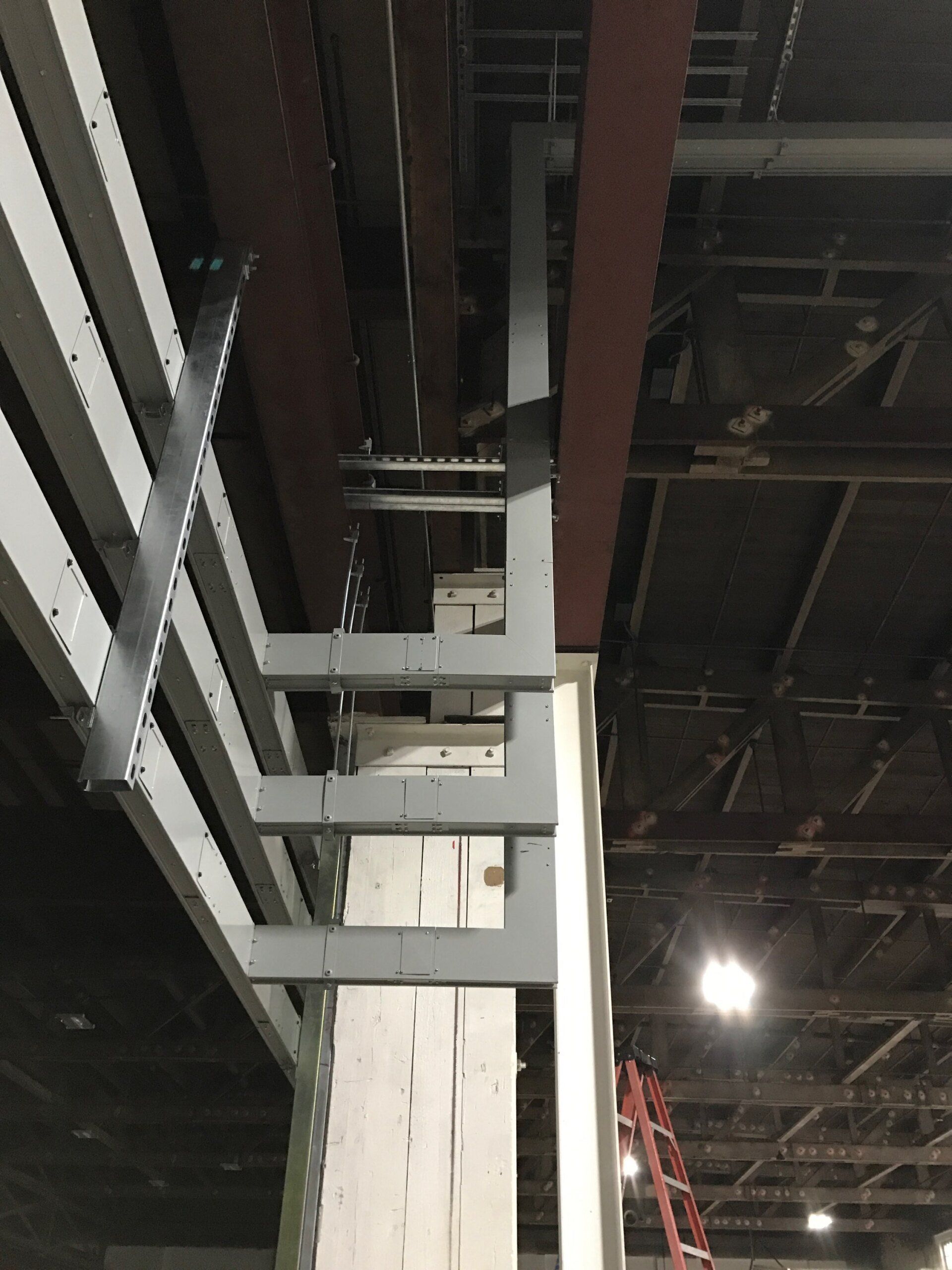 A ladder is hanging from the ceiling of a building