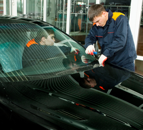 two men fixing windshield