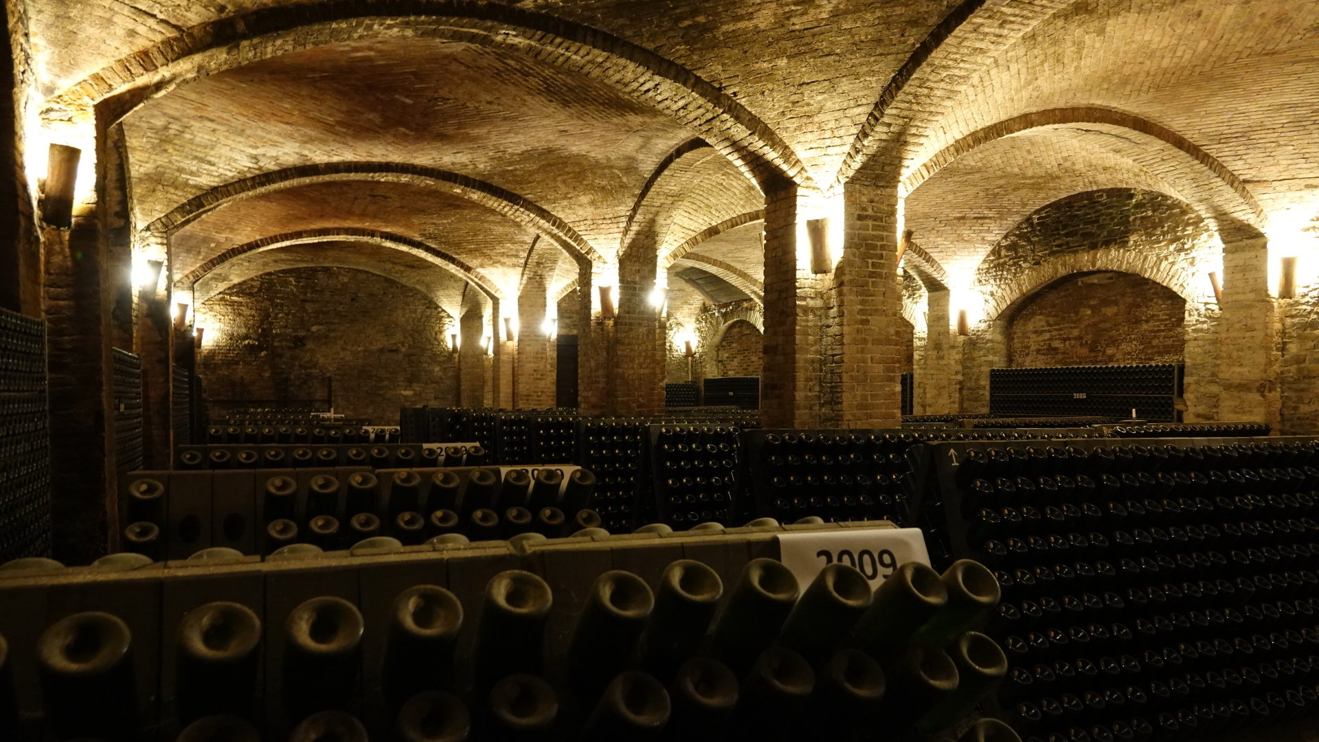 A wine cellar filled with lots of bottles of wine