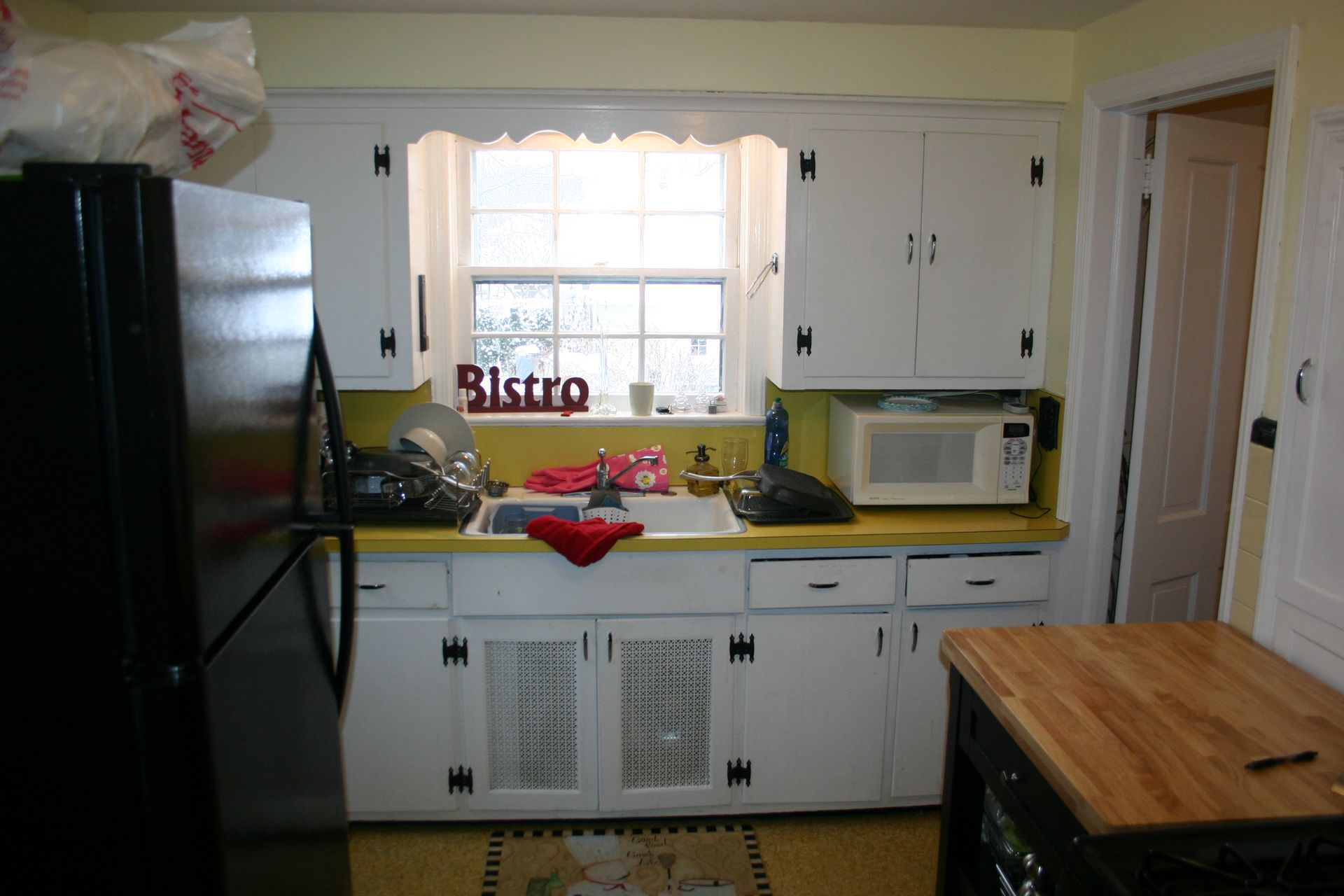 A kitchen with a sign that says bistro on it