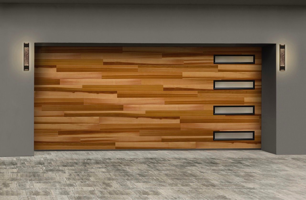 A wooden garage door with a concrete driveway in front of it.