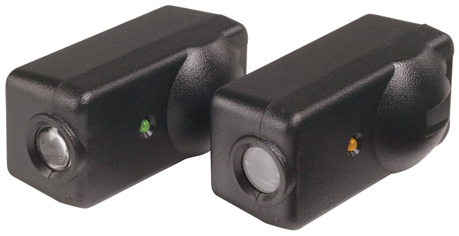 A pair of black speakers with green and yellow lights on them