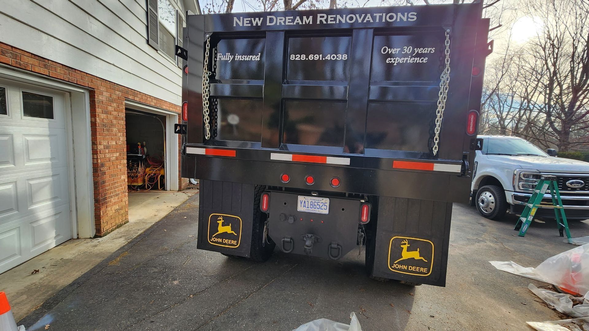 Rear view of a black dump truck with 