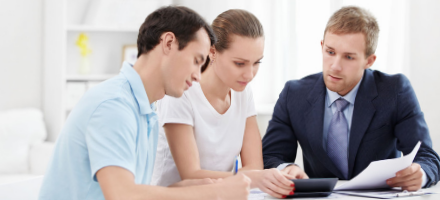 Couple and agent having discussion