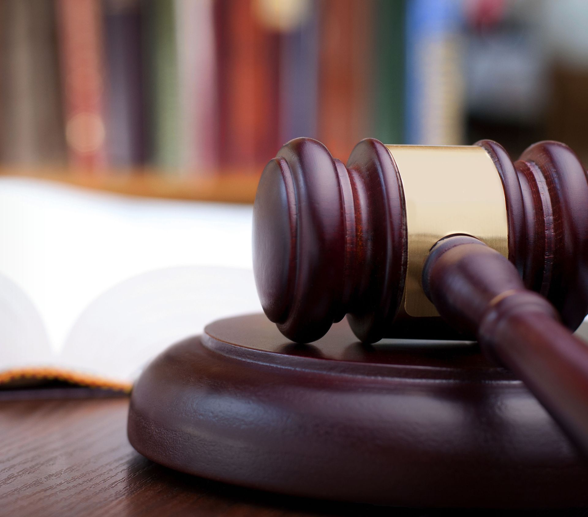 Learn More About Probate Law Gavel on wooden block in front of an open book