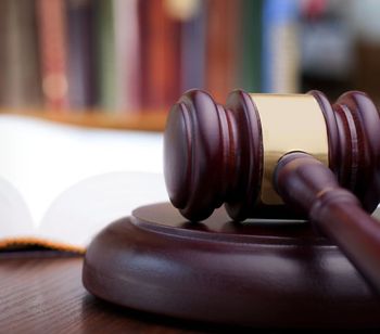 Learn More About Probate Law Gavel on wooden block in front of an open book