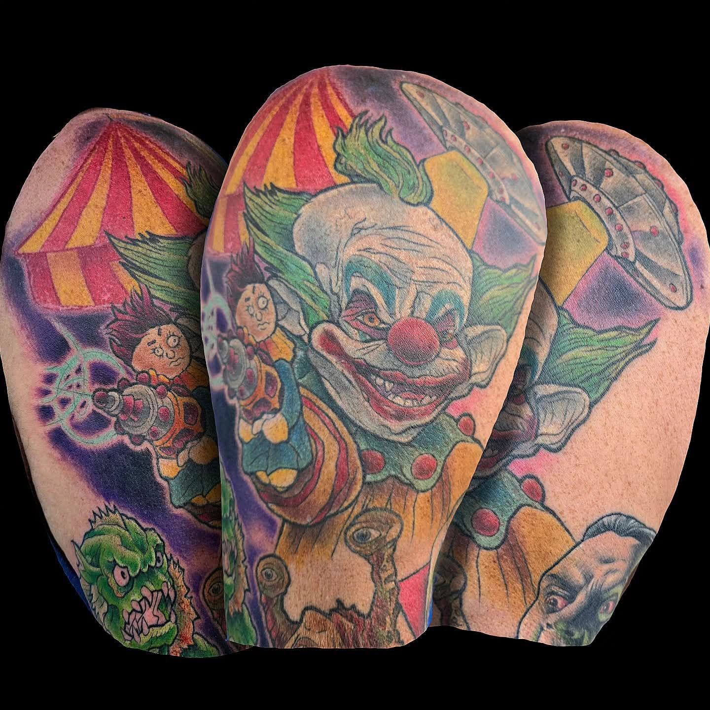 Three colorful arm tattoos, a clown, a circus tent, and a spaceship, all with a horror theme.