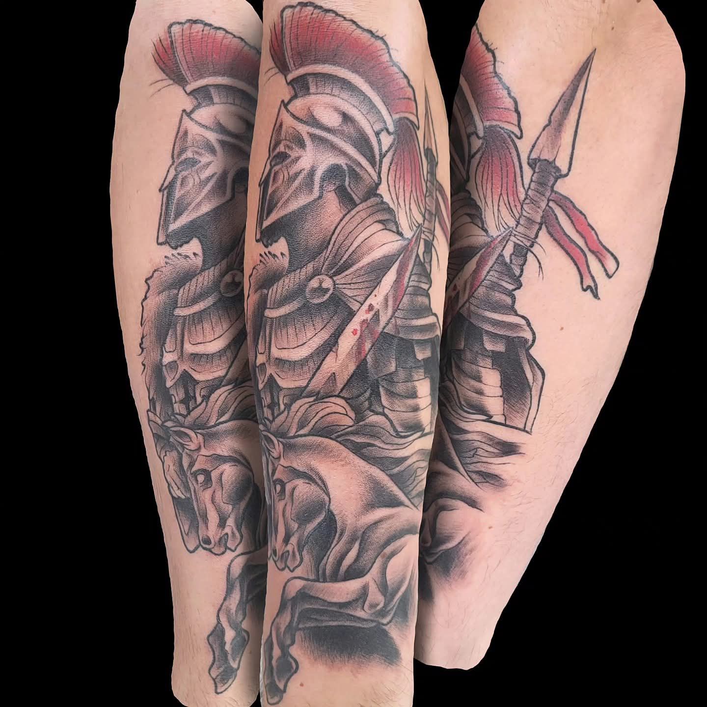 Tattoo of a Spartan warrior on horseback, in profile, with a spear and armor; black and red color scheme.