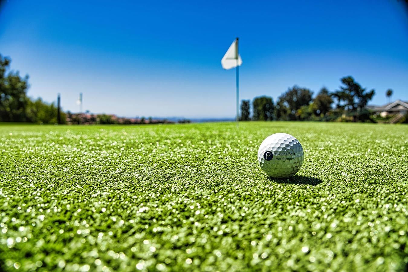 A golf ball is on the green of a golf course.
