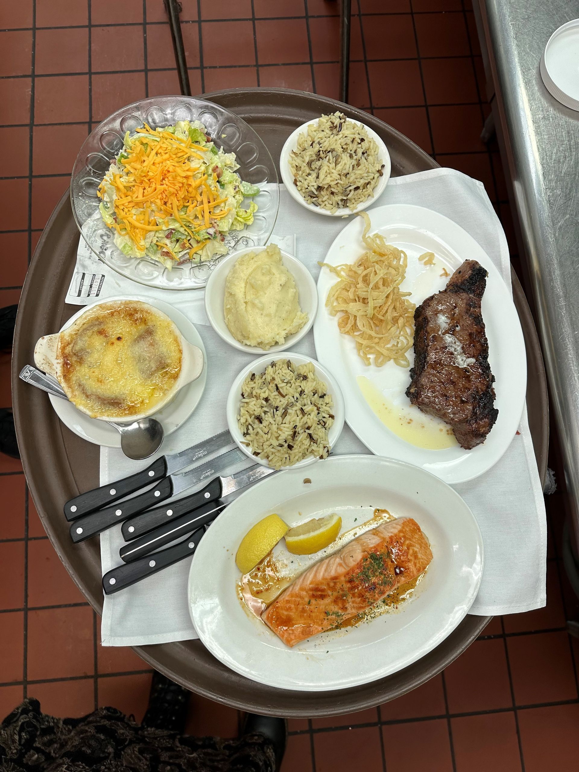 a table topped with plates of food and utensils