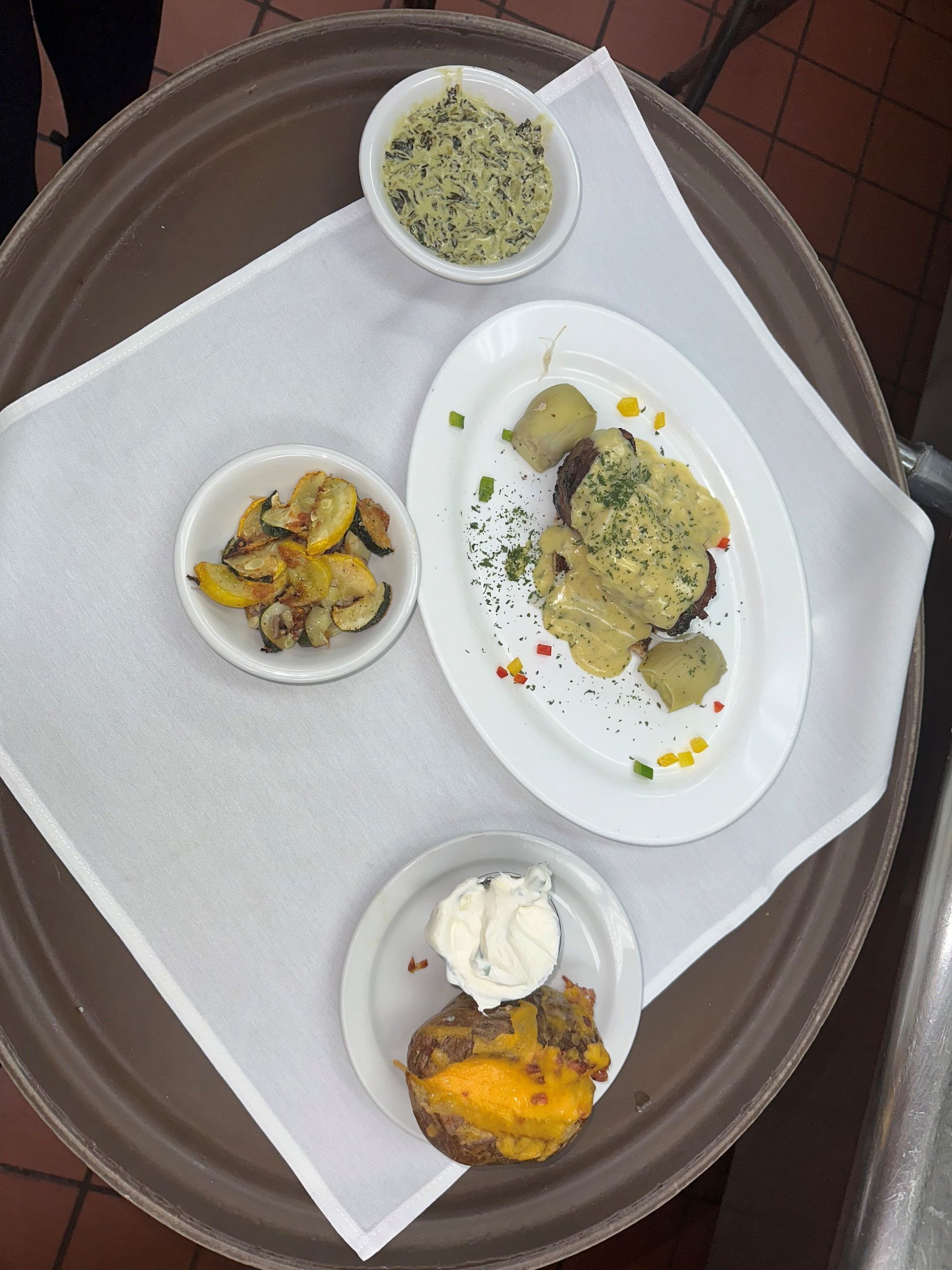 a tray of food including a baked potato and rice