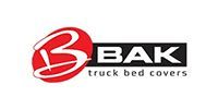 BAK truck bed covers logo with red emblem and black text on white background
