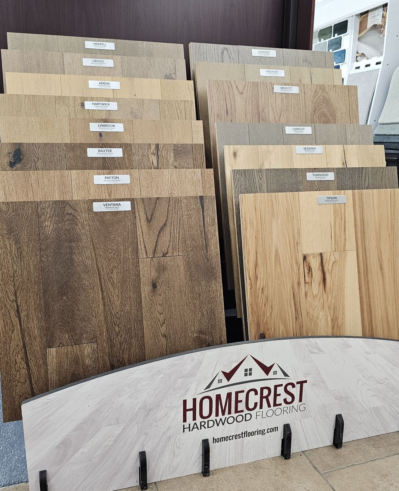 Display of Homecrest flooring samples in various wood tones.