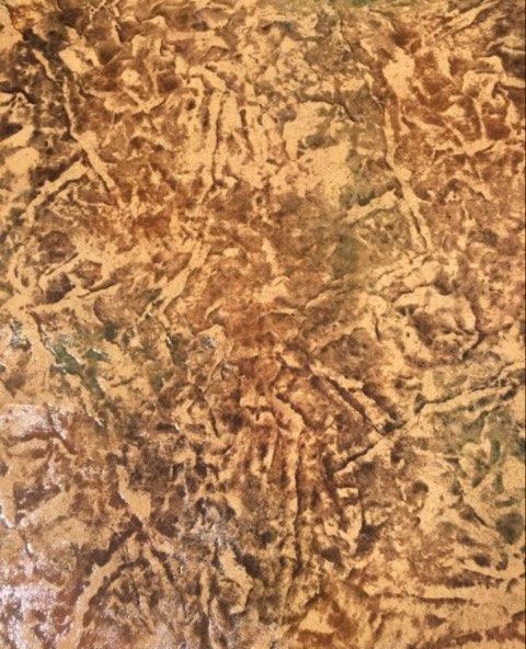 Textured brown and tan surface with crinkled and layered appearance.