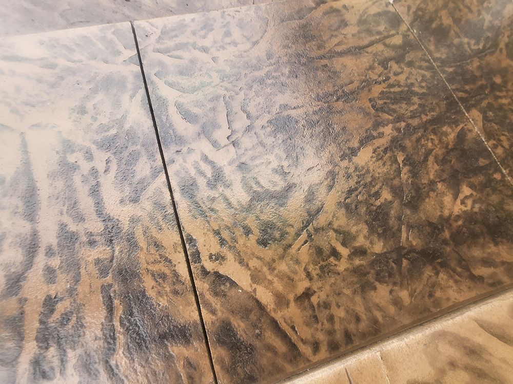 Brown and gray patterned tile flooring with visible grout lines.