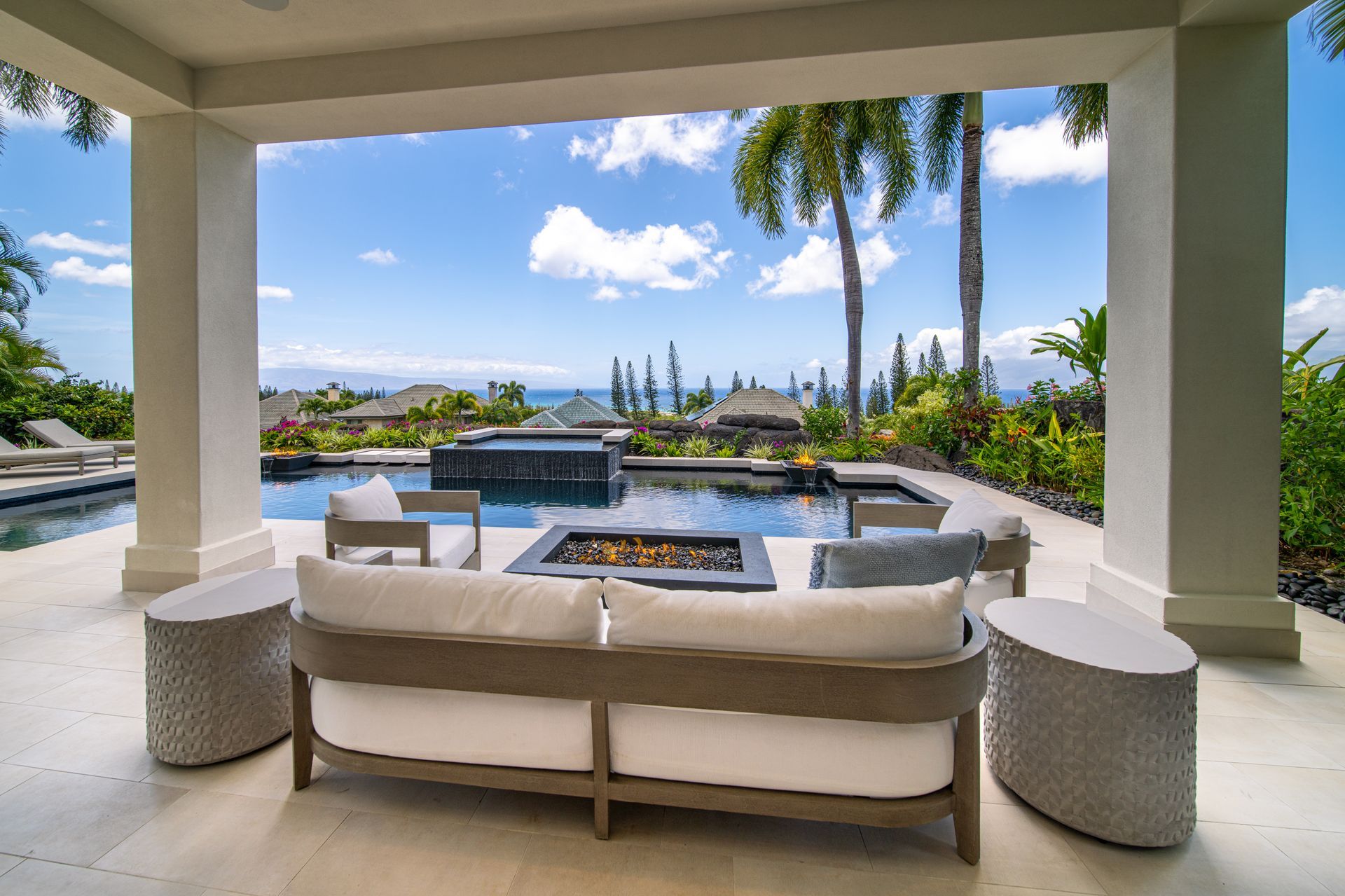 A patio with a fire pit and a couch
