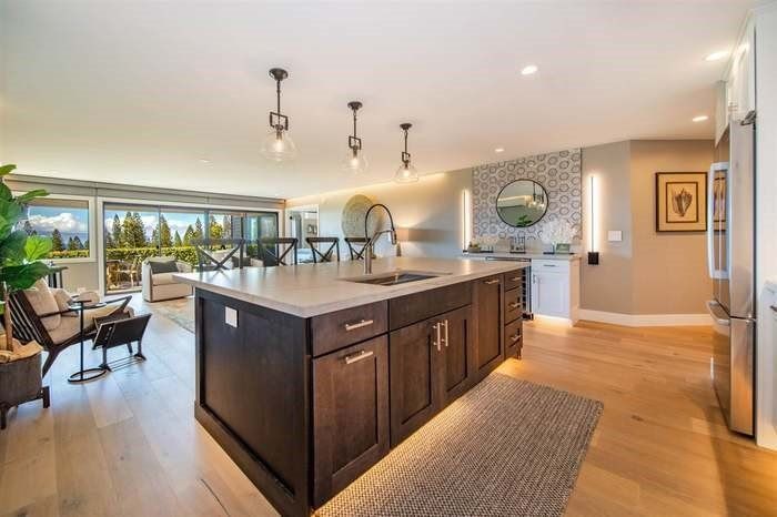 There is a large island in the middle of the kitchen.