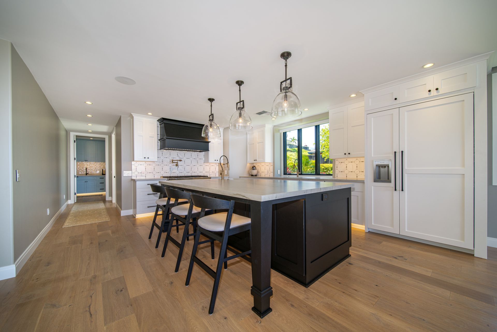 There is a large island in the middle of the kitchen.