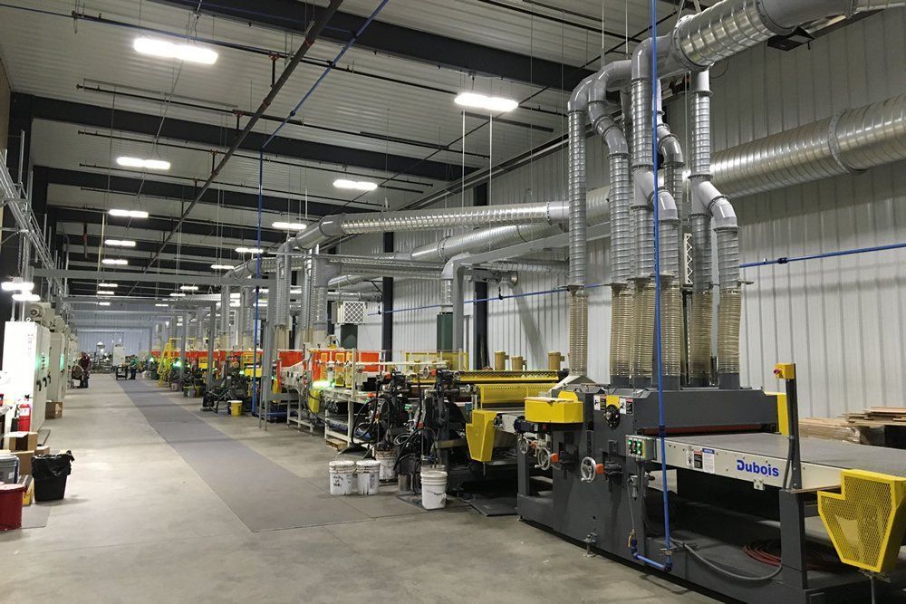 A large warehouse filled with lots of machinery.